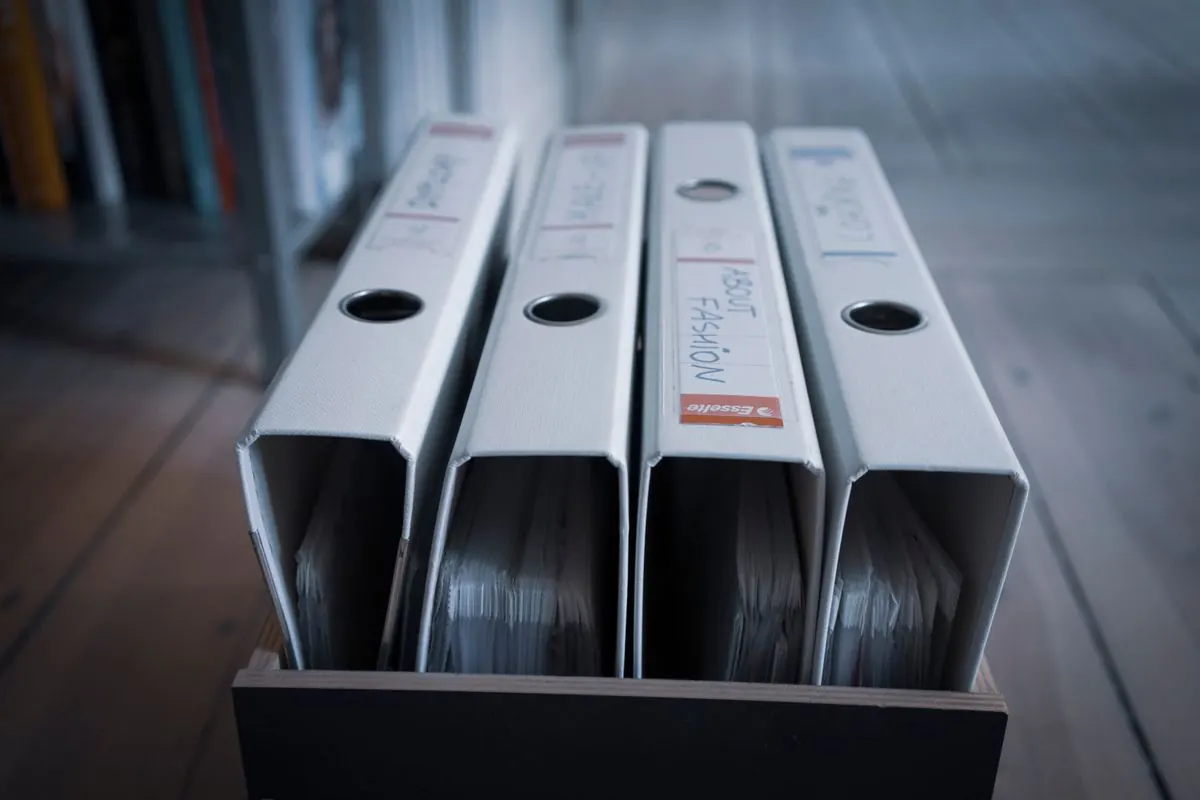 Labeled binders of records in a file box